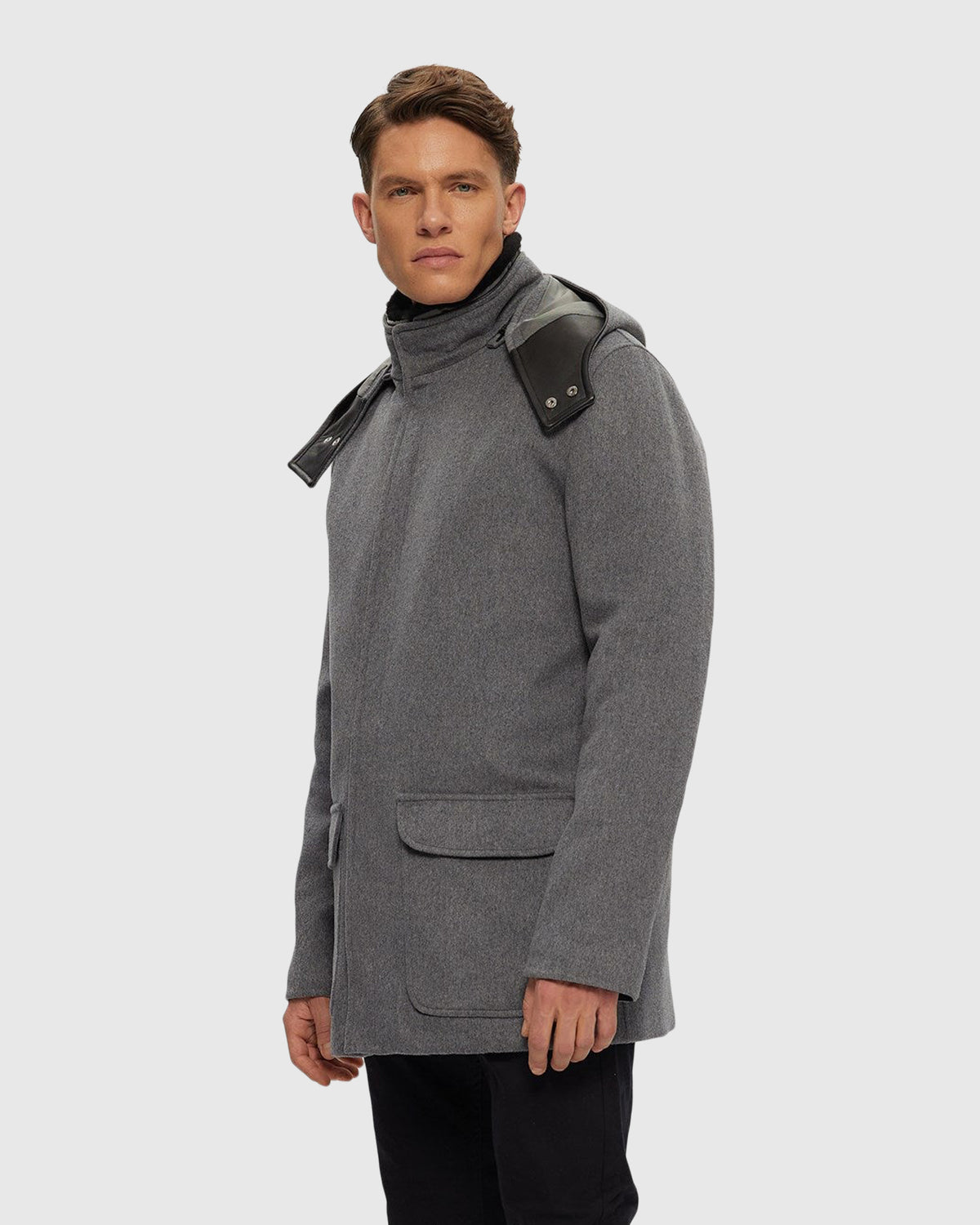 Men's wool parka crafted from Loro Piana with leather trim and detachable hood and shearling lamb collar in gray and black, side view