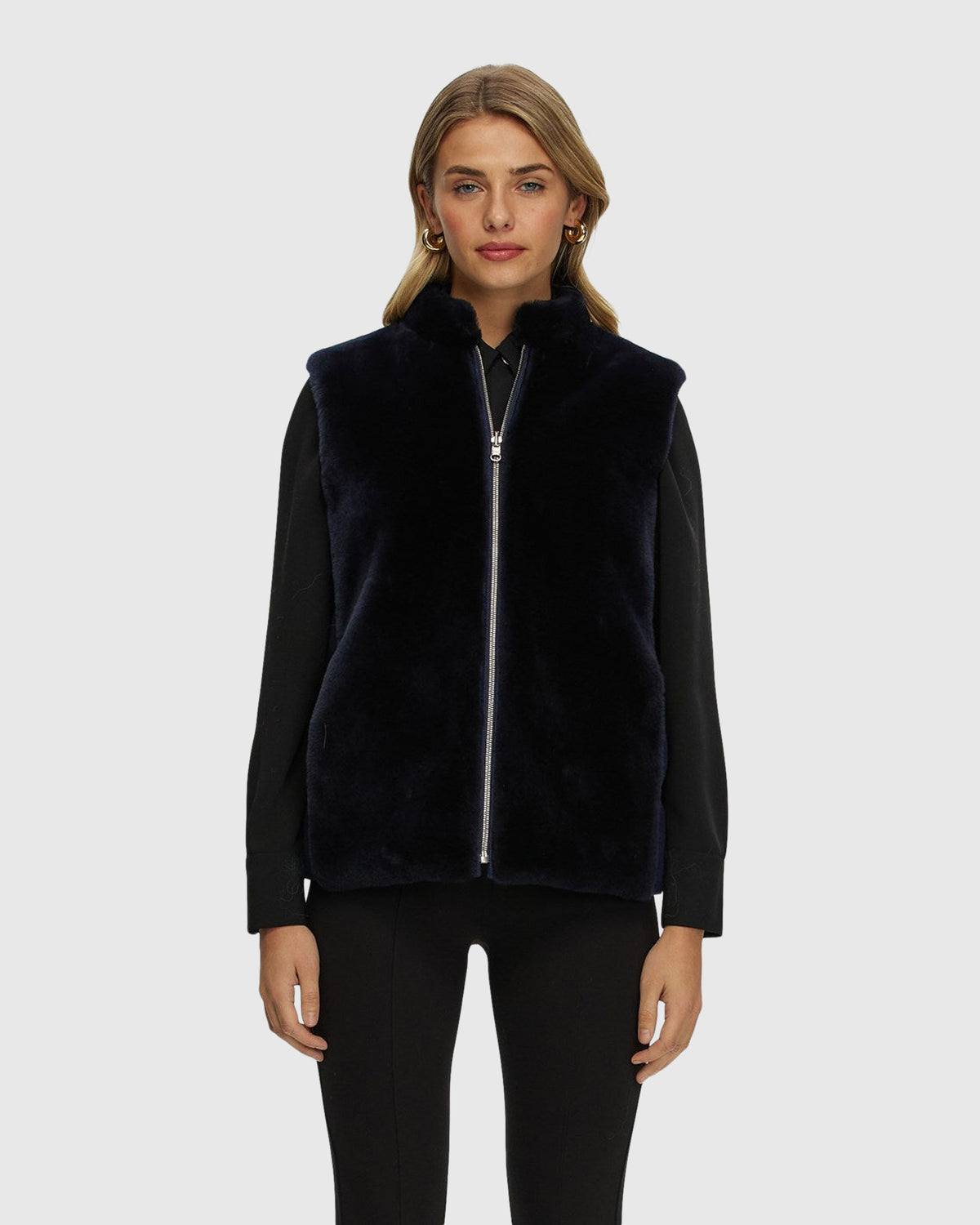 Reversible select shearling lamb vest with wool and cashmere quilted down back crafted from Loro Piana in navy, front view